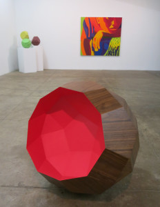 Sarah Bednarek, Concave Sibling, MDF walnut, paint, 30 x 30 x 30 inches, 2016 (foreground.)  Leigh Ruple, Listless, Idle, oil on canvas, 60 x 66 inches, 2014.