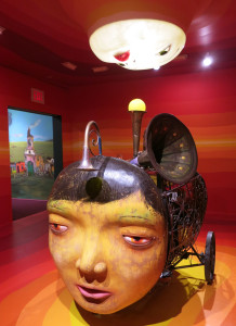 OSGEMEOS, O Beijo (The Kiss), musical instruments, mechanical and electrical equipment, wood, metal, steel and fiberglass resin, 90.55 x 57.09 x 70.87 inches, 2015-16.