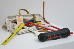 Mark Dion, F.B.I. Tool Bag of Dirty Tricks, fabric bag, nine tools covered in liquid rubber with enamel, extra item: plunger, 1991.